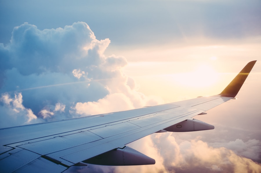 Airplane wing above clouds for travel and visa support
